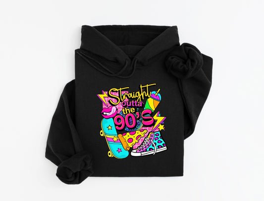 A black hoodie featuring a vibrant retro design with the text “Straight Outta the 90’s.” The graphic includes colorful illustrations of a skateboard, pizza slice, neon sneakers, and other playful 90’s-inspired elements